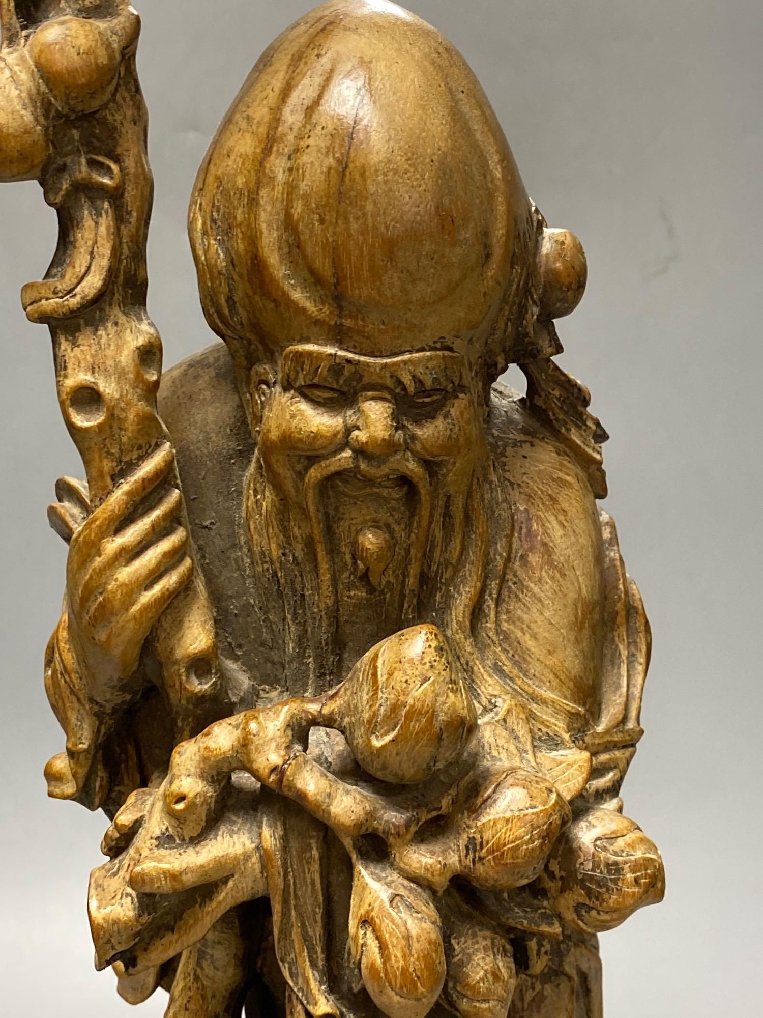 A Chinese carved hardwood figure of Shou Lao, 53cm